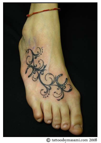 Horseshoe foot tattoo